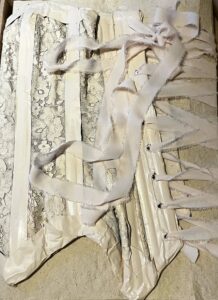 A Bookwork made from an upcycled corset by Redell Olsen 2026